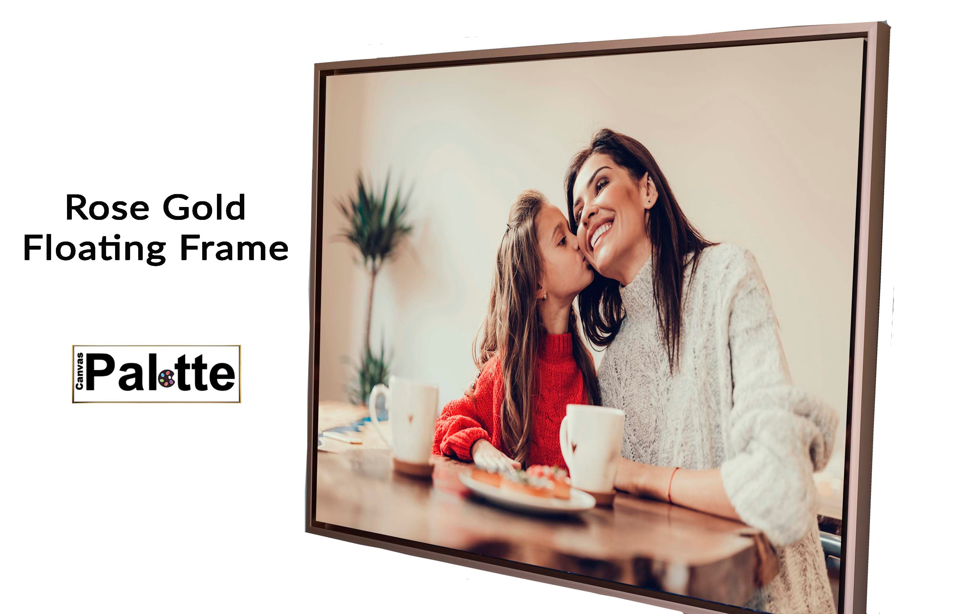 CanvasPalette.com example of a rose gold, floating sideframe for canvas framing a landscape photo of a mother receiving a kiss from her daughter, both sitting in the dining room.
